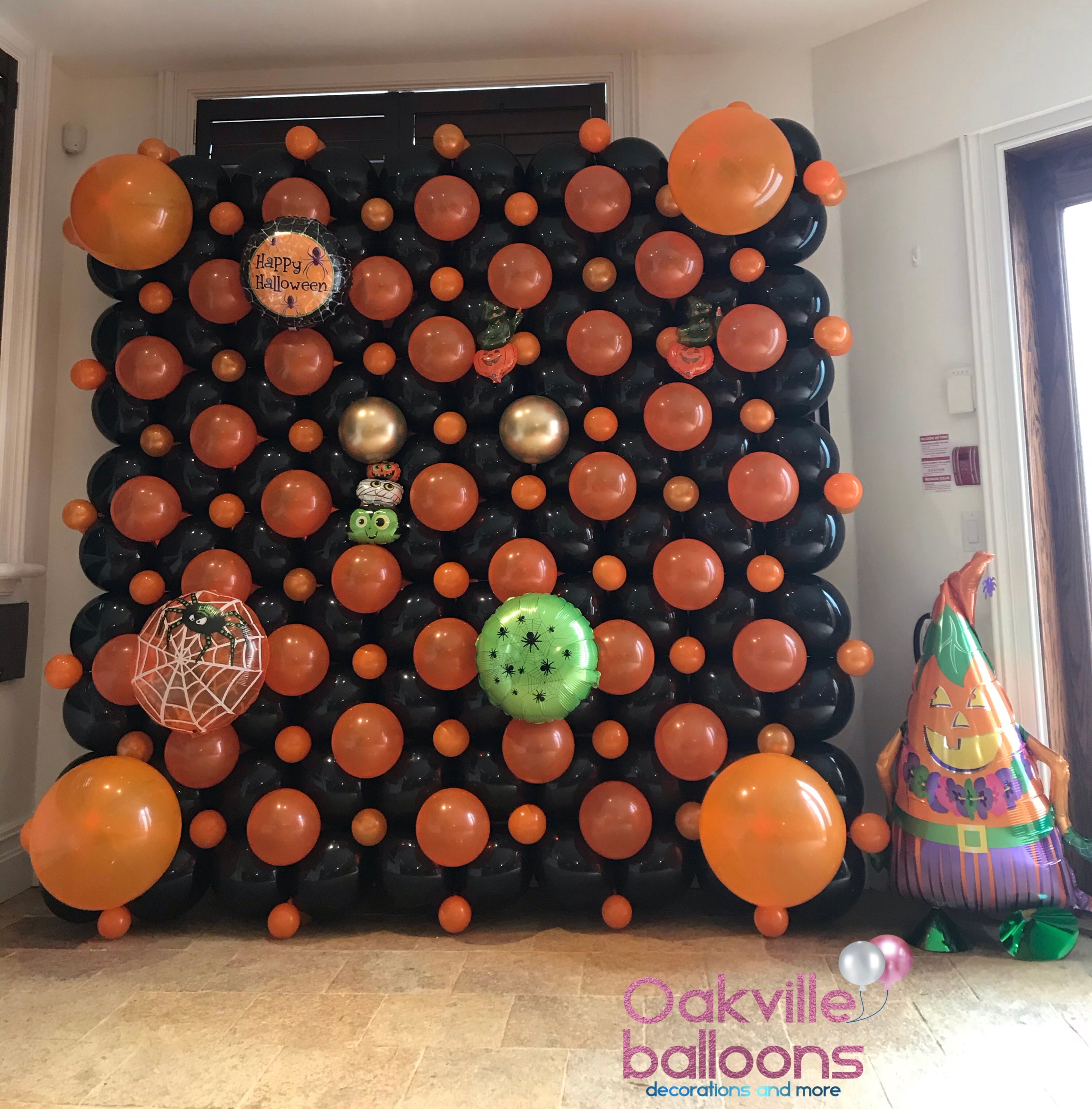 Balloon symmetrical wall display in orange and black.